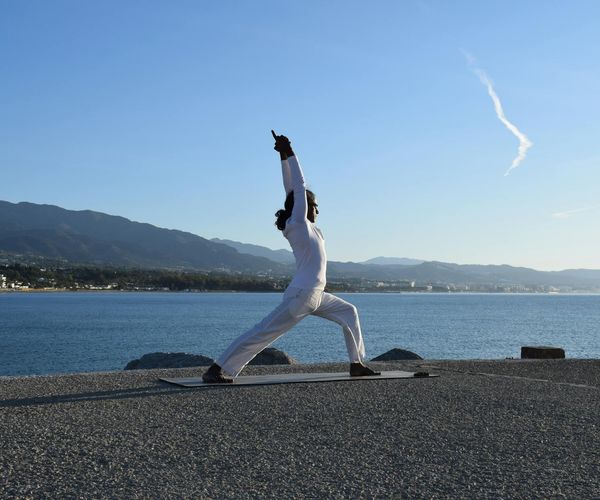 Man meditating peacefully after a workout session, showing mental clarity.